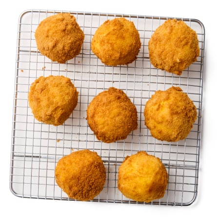 Step 8a Felicity Cloake’s arancini are cooling on a wire rack.