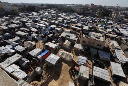 An image of a camp taken from above, showing temporary shelters