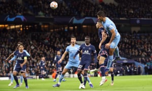 Manchester City’s Rodri heads at goal.