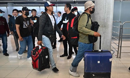 Thai nationals arrive at Suvarnabhumi airport in Bangkok on 12 October after an evacuation flight from Israel.