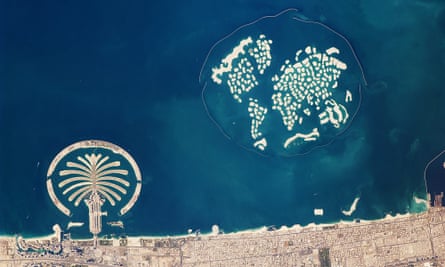 The splotchy islets of The World development next to its neatly laid-out cousin the Palm Jumeirah.
