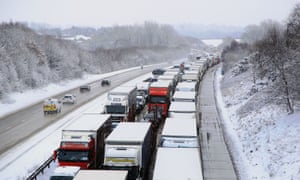 Stationary traffic on the M20 near Ashford, Kent, following heavy overnight snowfall which has caused disruption across Britain.