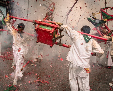 Firecrackers are set off as devotees gather at a Chinese shrine in Trang, Thailand