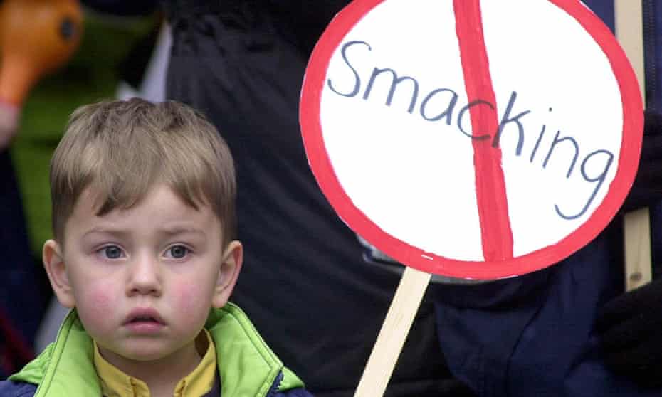 Child with anti-smacking sign