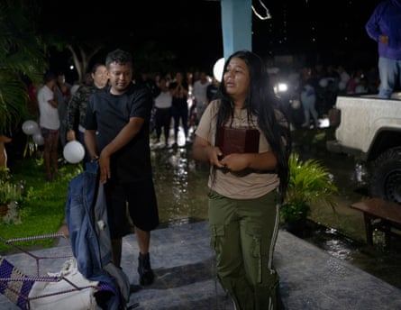 Carmen, 23, Alexandra’s sister, enters her family’s house carrying her sister’s ashes