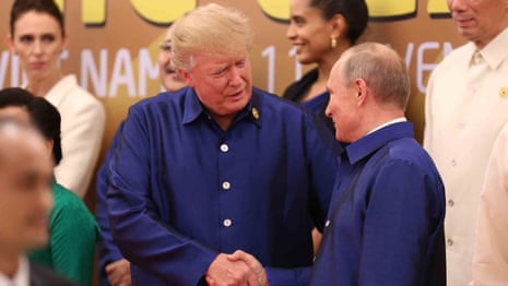 Donald Trump and Vladimir Putin shake hands at Apec – video