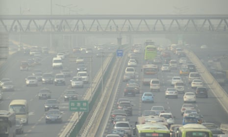 A congested freeway in heavy smog