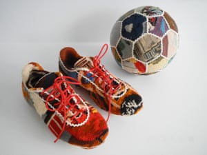 A football and boots by Swedish designer Ulla-Stina Wikander, who covers 1970s household objects in second-hand cross-stitches