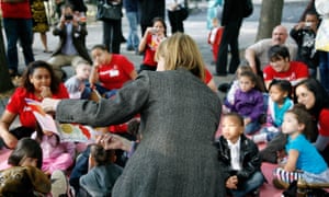 Patricia Harris, the deputy mayor of Manhattan, reads The Snowy Day during the fifth annual Jumpstart Read for the Record Day.