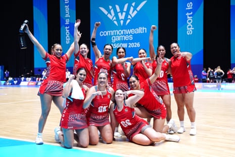 Tonga players celebrate victory against Wales.