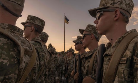 Ukrainian cadets stand looking into the distance