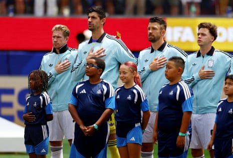 Thibaut Courtois (second left) sings the Belgian national anthem alongside Kevin De Bruyne (left), Brandon Mechele (second right) and Maxim De Cuyper.