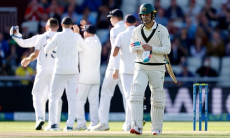 Australia's Alex Carey walks after losing his wicket, caught by England's Jonny Bairstow off the bowling of Chris Woakes.