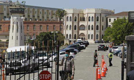 A correctional officer closes the main gate at San Quentin state prison in San Quentin, California, last month.