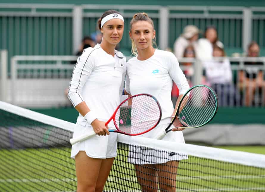 Anhelina Kalinina (left) and Lesia Tsurenk, both from the Ukraine pose in solidarity prior to their match against each other.