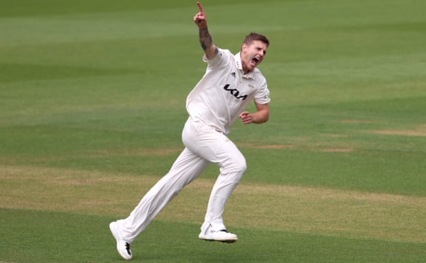 Conor McKerr celebrates after taking the wicket of Chris Benjamin during Surrey’s win over Warwickshire.