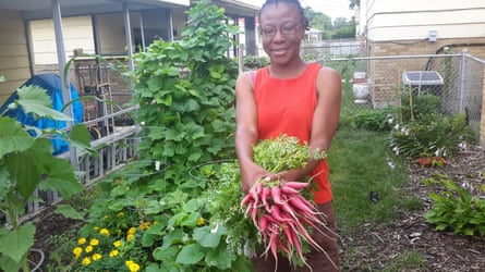 Jacqueline Smith holding some produce from her garden in Chicago, 2016.
