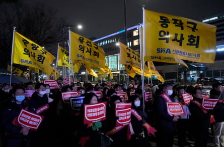 Doctors stage a rally against the government’s medical policy near the presidential office in Seoul, South Korea.