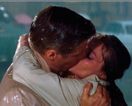 George Peppard and Audrey Hepburn kiss in the rain