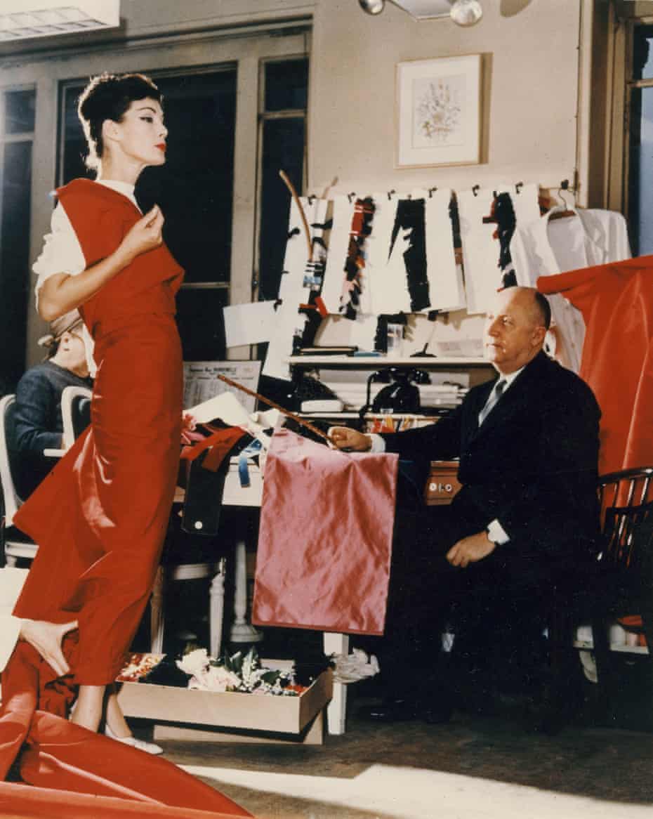 Christian Dior with model Lucie Daouphars, AKA Lucky, circa 1955 in his atelier at 30 Avenue Montaigne.