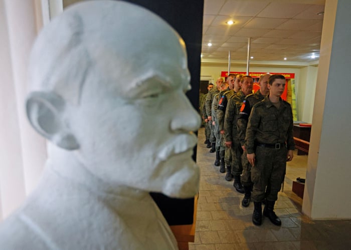 Service members of the self-proclaimed Luhansk People’s Republic vote in Luhansk.