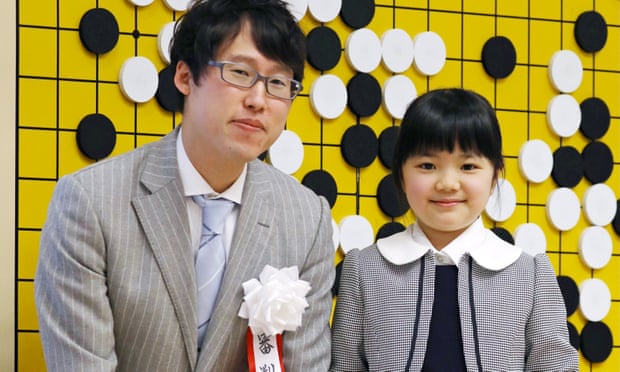 Sumire Nakamura poses in front of a Go board with professional player Yuta Iyama. She turns pro herself on 1 April 2019.