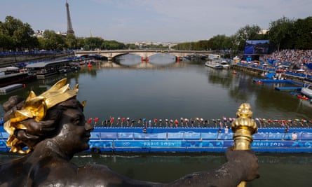Athletes compete at the Seine during the men’s triathlon