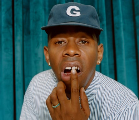 Head shot of Tyler, the Creator, against turquoise backdrop, photographed in London September 2019