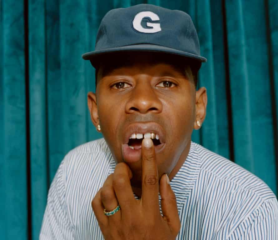 Head shot of Tyler, the Creator, against turquoise backdrop, photographed in London September 2019