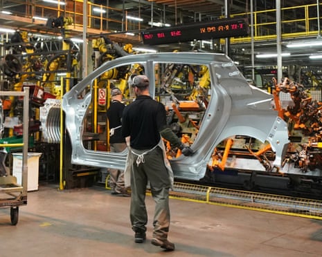 Workers on the production line at the Nissan factory