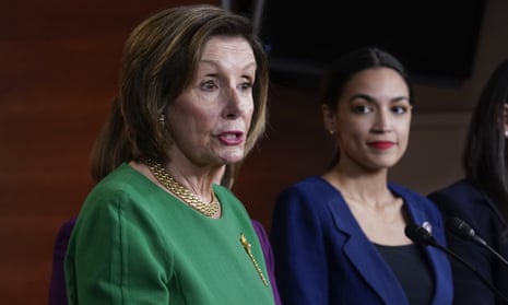 Nancy Pelosi speaks on Capitol Hill as Alexandria Ocasio-Cortez looks on, in June 2021.