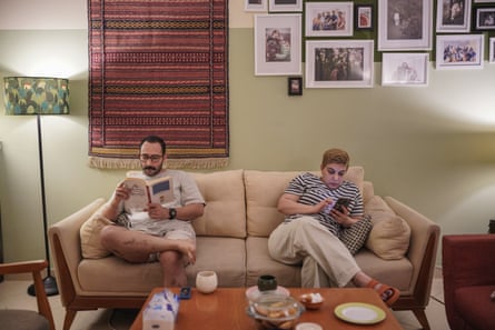 Nafise and Farhad in their Tehran home on their sofa