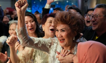 Janet Yeoh, the mother of Michelle Yeoh, celebrates her daughter’s Oscars victory at a cinema in Kuala Lumpur.