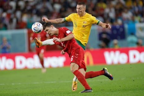 Denmark’s Andreas Christensen gets is head to the ball ahead of Mitchell Duke.