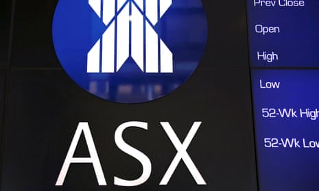 FILE PHOTO: A board displaying stock prices is adorned with the Australian Securities Exchange (ASX) logo in central Sydney, Australia, February 13, 2018. Picture taken February 13, 2018. REUTERS/David Gray/File Photo