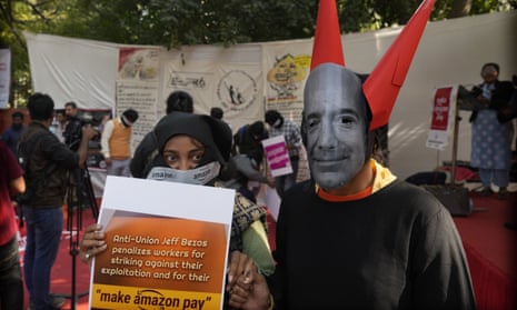 Someone dresses as Amazon’s Jeff Bezos as they join other workers in a protest over pay and conditions in New Delhi, India.