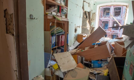 Destroyed interior of office with files is disarray