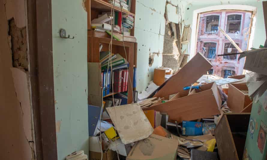 Destroyed interior of office with files is disarray