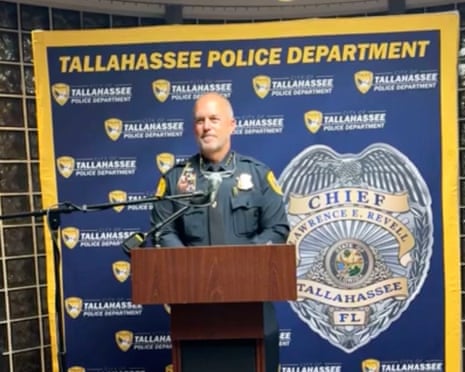 a police chief stands at a lectern