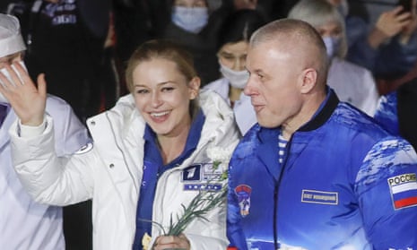 Actress Yulia Peresild (L) and cosmonaut Oleg Novitsky (R)
