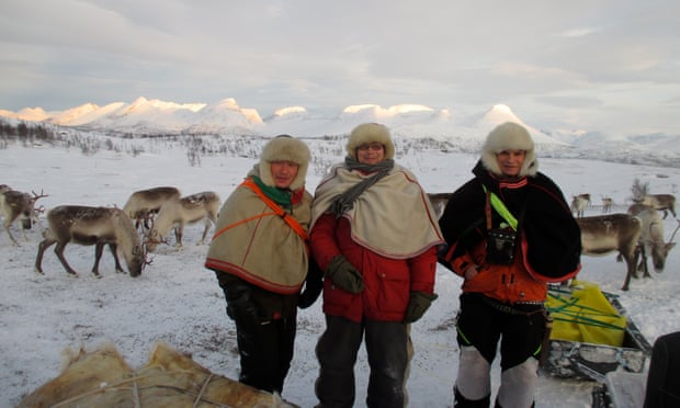 Sami reindeer herders tend to their animals near Tromso, Norway.