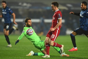 Diogo Jota beats Marco Sportiello to the ball on his way to completing his hat-trick for Liverpool at Atalanta.