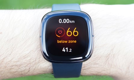Fitbit Sense on wrist, showing heart rate