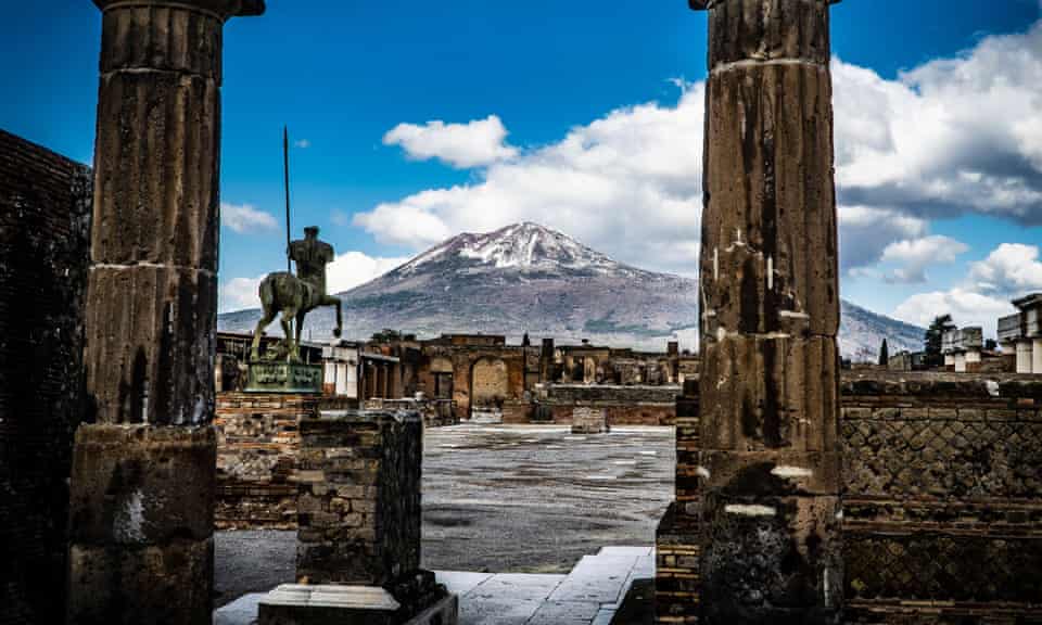 Pompeii in February with the snow-covered peak of Mount Vesuvius in the background.
