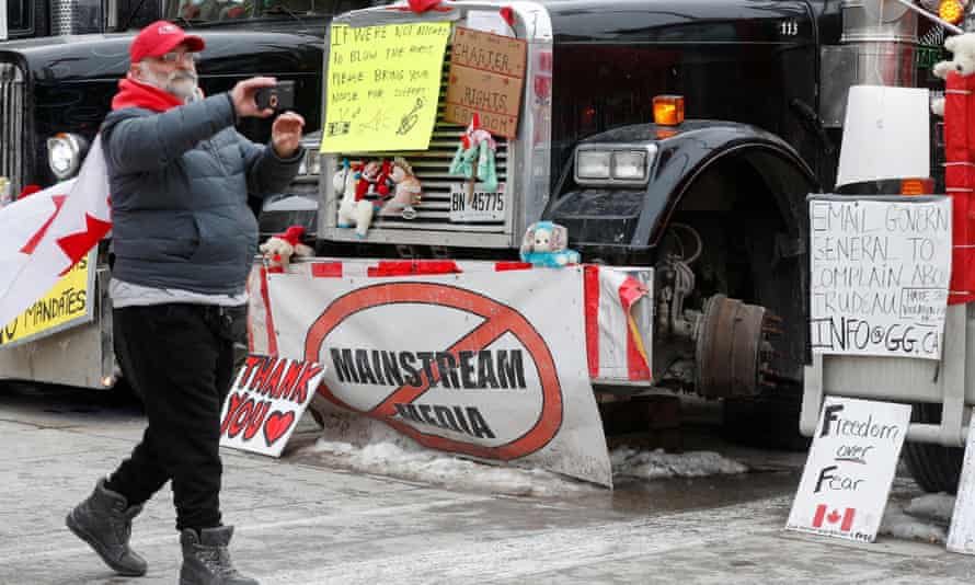 A truck parked in front of Parliament Hill has one of its front wheels removed as truckers and supporters continue to protest coronavirus vaccine mandates, in Ottawa, Ontario, Canada.