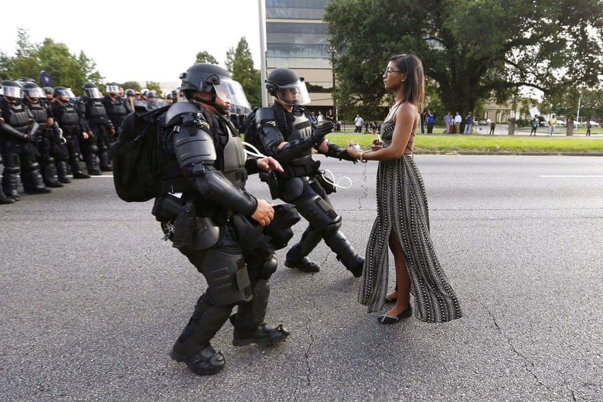 Ieshia Evans and riot police during a protest against police brutality at the Baton Rouge police department in Louisiana on 9 July, 2016.