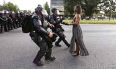 FILE PHOTO --  Lone activist Ieshia Evans stands her ground while offering her hands for arrest as she is charged by riot police during a protest against police brutality outside the Baton Rouge Police Department in Louisiana, USA, 9 July 2016. Evans, a 28-year-old Pennsylvania nurse and mother of one, traveled to Baton Rouge to protest against the shooting of Alton Sterling. Sterling was a 37-year-old black man and father of five, who was shot at close range by two white police officers. The shooting, captured on a multitude of cell phone videos, aggravated the unrest coursing through the United States in previous years over the use of excessive force by police, particularly against black men. REUTERS/Jonathan Bachman/File Photo
