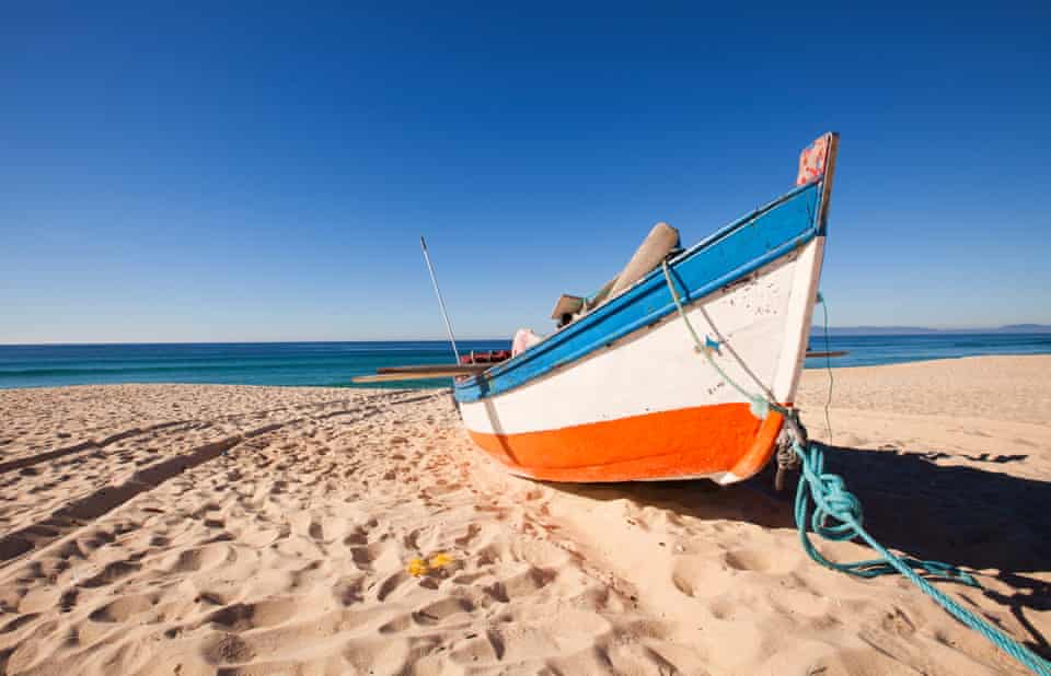 Fisherman’s boat on the beach, at Troia, Portugal.