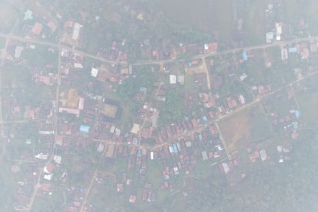 An aerial photo shows smoke from wildfires blanketting Lanjak village in Kapuas Hulu, West Kalimantan