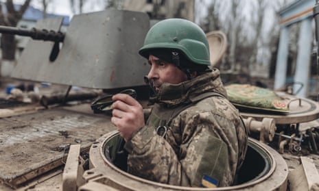 Ukrainian soldiers on an armoured military vehicle in Chasiv Yar, eastern Ukraine